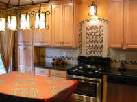kitchen picture, kitchen cabinets, island kitchen table, dishwasher, kitchen lighting, flooring  in the kitchen, chairs